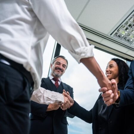 Caucasian businessman making a handshake together while stand in office.-10