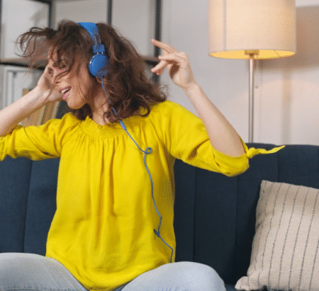 Woman in Headphones Listening Music and Dancing-100